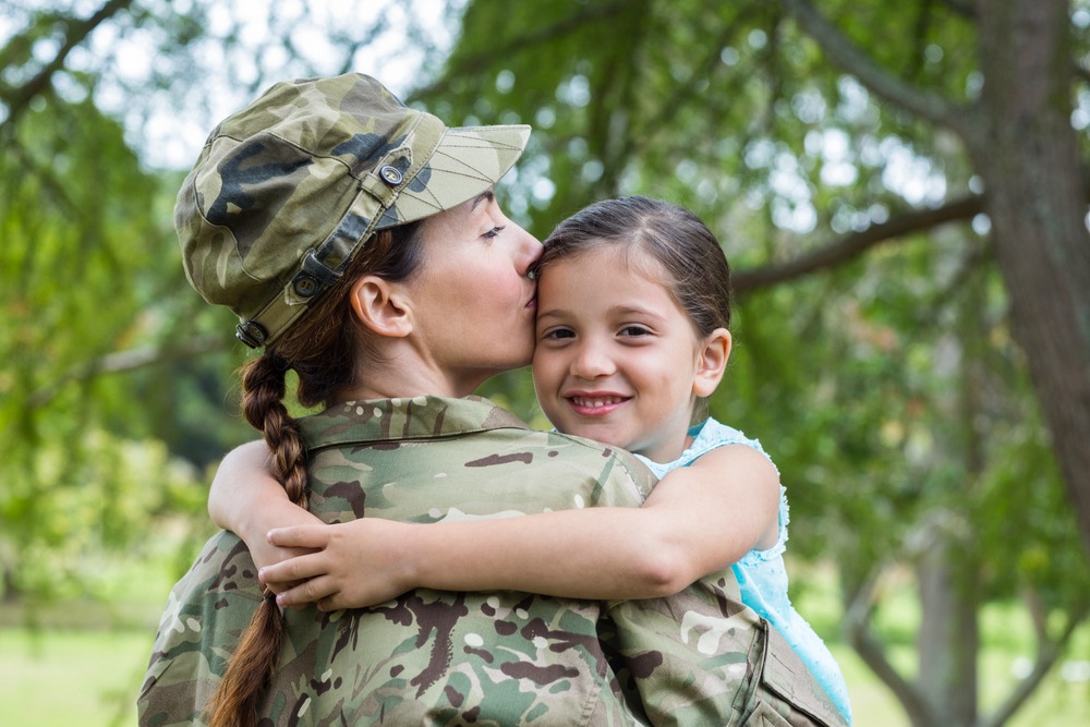 VA Individual Unemployability Texas - Soldier reunited with her daughter on a sunny day